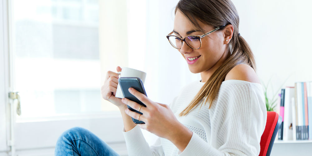 bigstock-Woman-Watching-Media-In-A-Lapt-84420767
