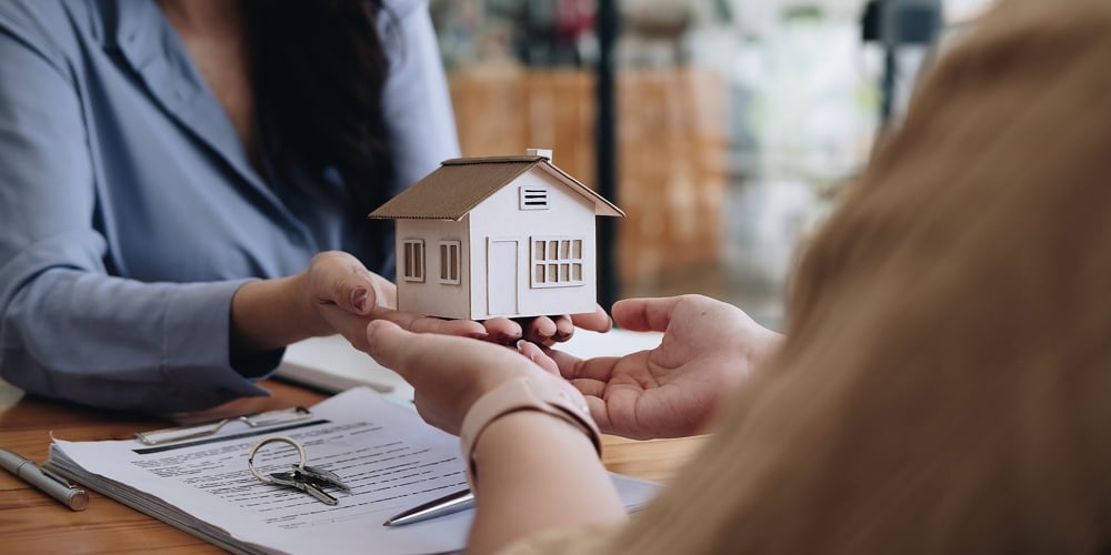 Real Estate Agent Or Sales Manager Offer Home Sale And Explained The Terms Of Signing The House Purc