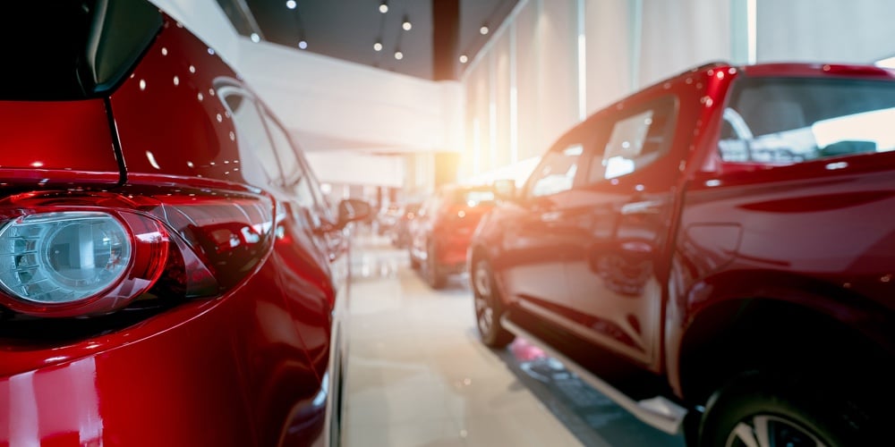 bigstock-Rear-View-Of-Red-Car-Parked-In-442447472