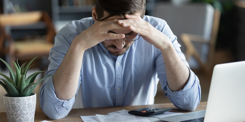 Sad Depressed Man Checking Bills