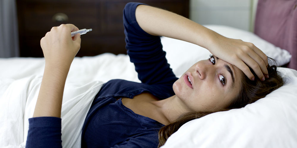 bigstock-Sad-Woman-With-Flu-In-Bed-Look-82743605
