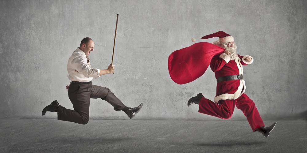 Santa Claus running away from a man who pursues him with a stick