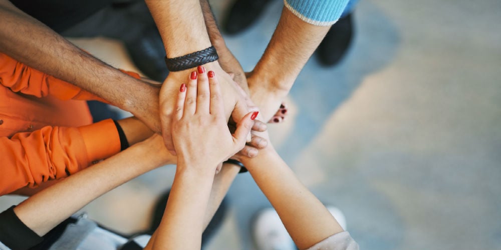 bigstock-Sea-Of-Hands-Showing-Unity-And-61933913
