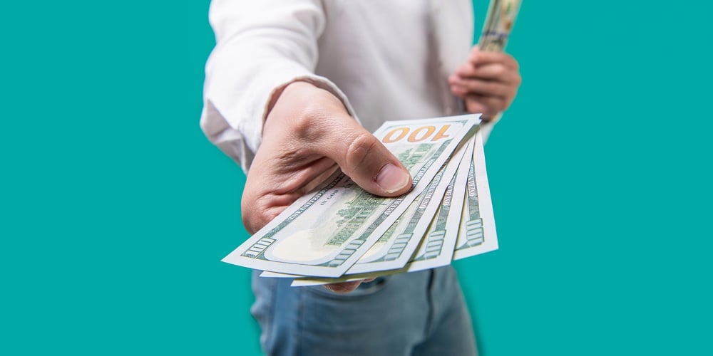 Selective Focus Of Paying Money Dollars Cash. Paying Money Dollars. Closeup Of Paying Money