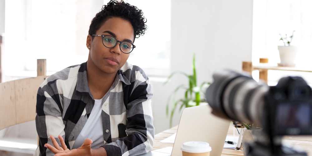 Serious African Girl Youtuber Blogger Talking To Camera Shooting Video