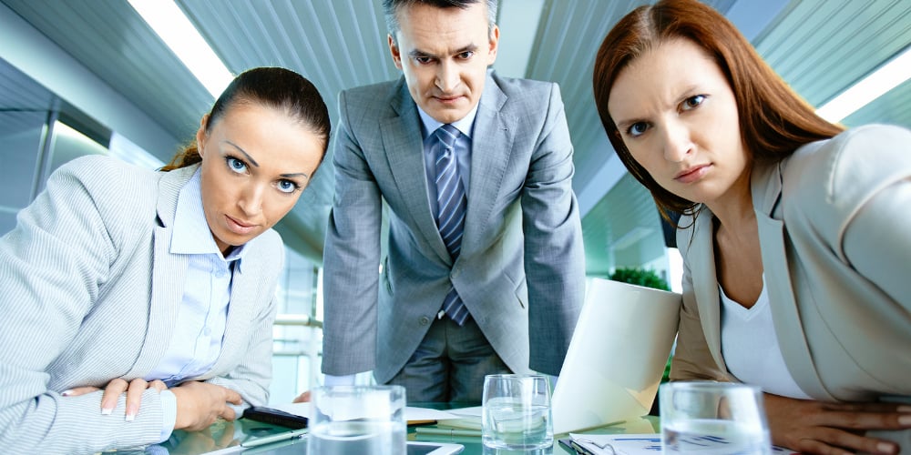 bigstock-Serious-boss-with-his-two-empl-44710093