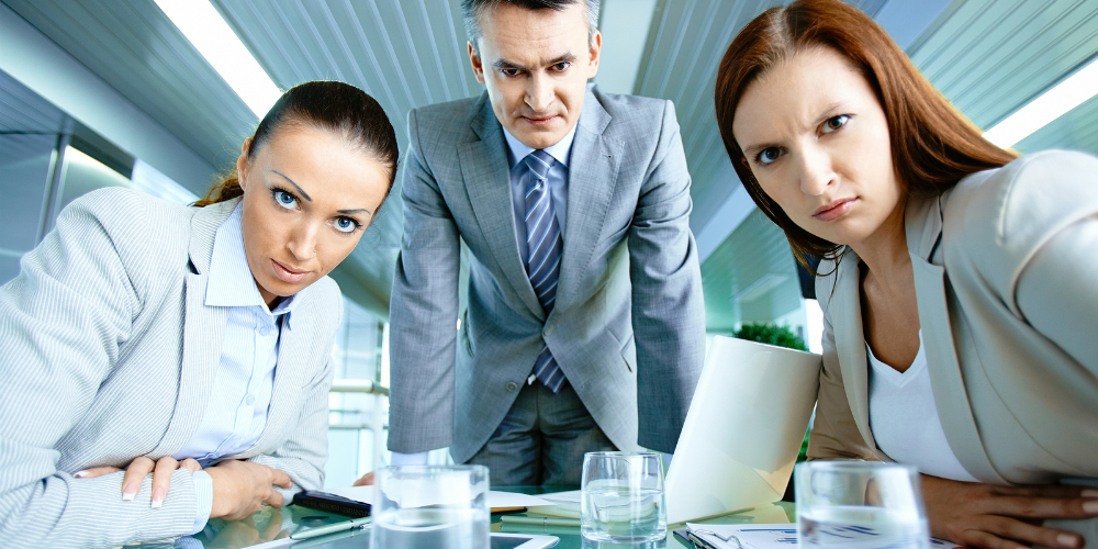 bigstock-Serious-boss-with-his-two-empl-44710093