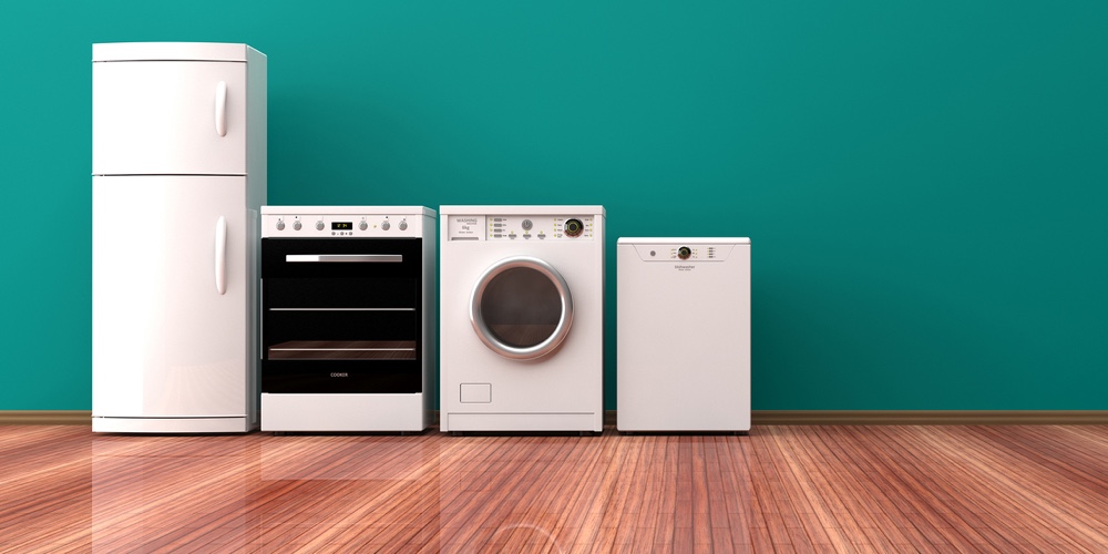 Set of electric home appliances on a wooden floor