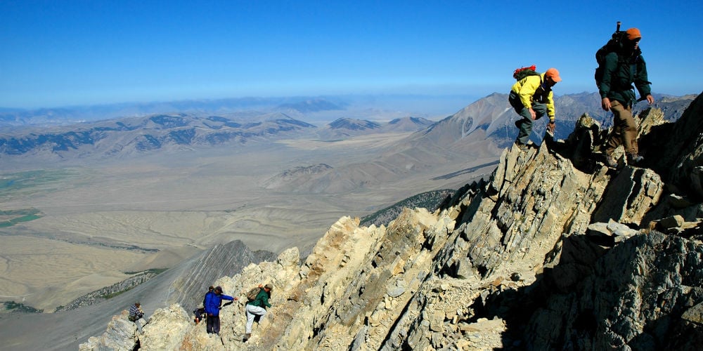 bigstock-Several-people-climbing-along-261723351