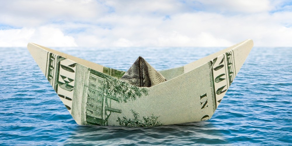 bigstock-Ship-From-Money-On-Water-86969024-e1450699863618