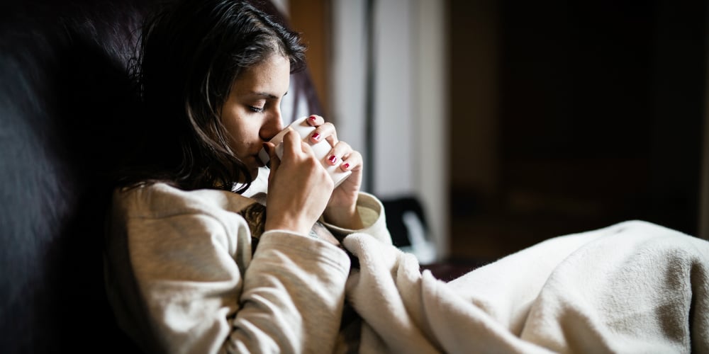 bigstock-sick-woman-in-bed-calling-in-s-118156796