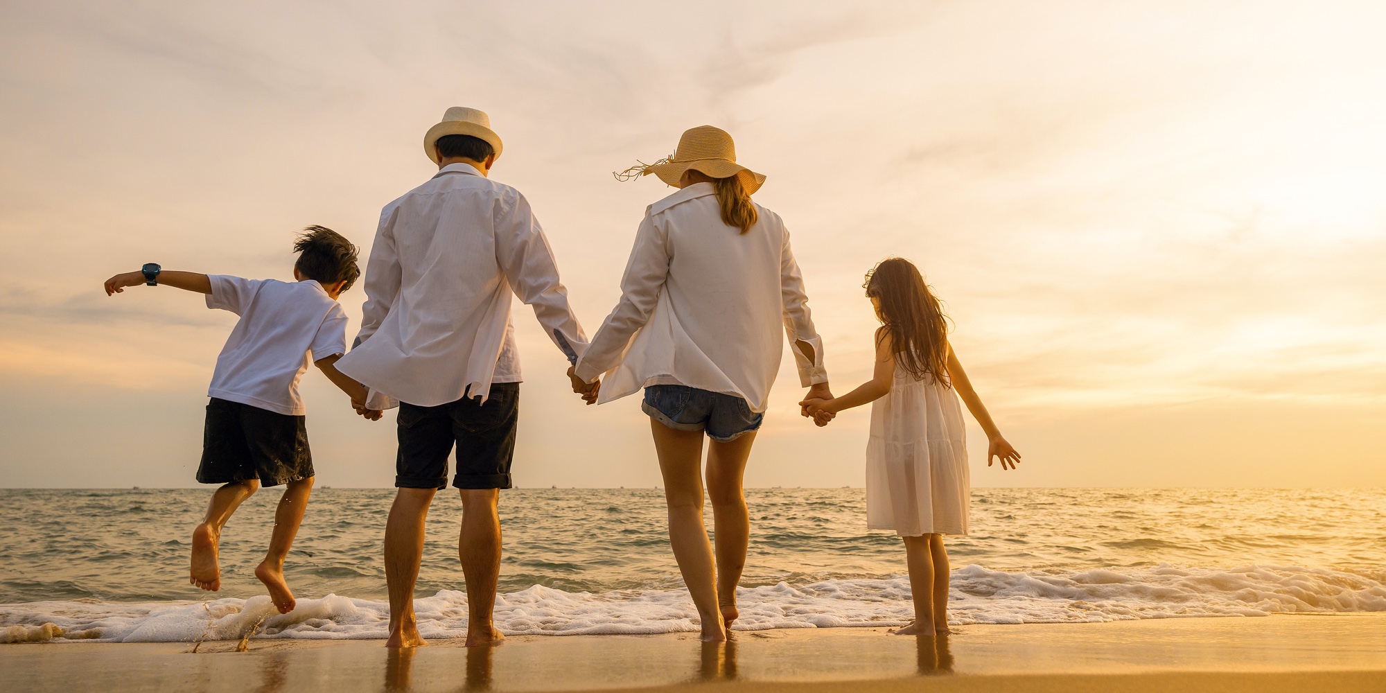 Silhouette Of Family Holding Hands Live Healthy Lifestyle On Beach