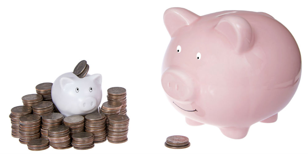 bigstock-Small-Piggy-Bank-With-Piles-Of-116687825