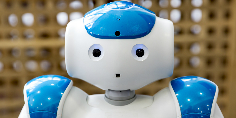 bigstock-Small-Robot-With-Human-Face-An-145228334