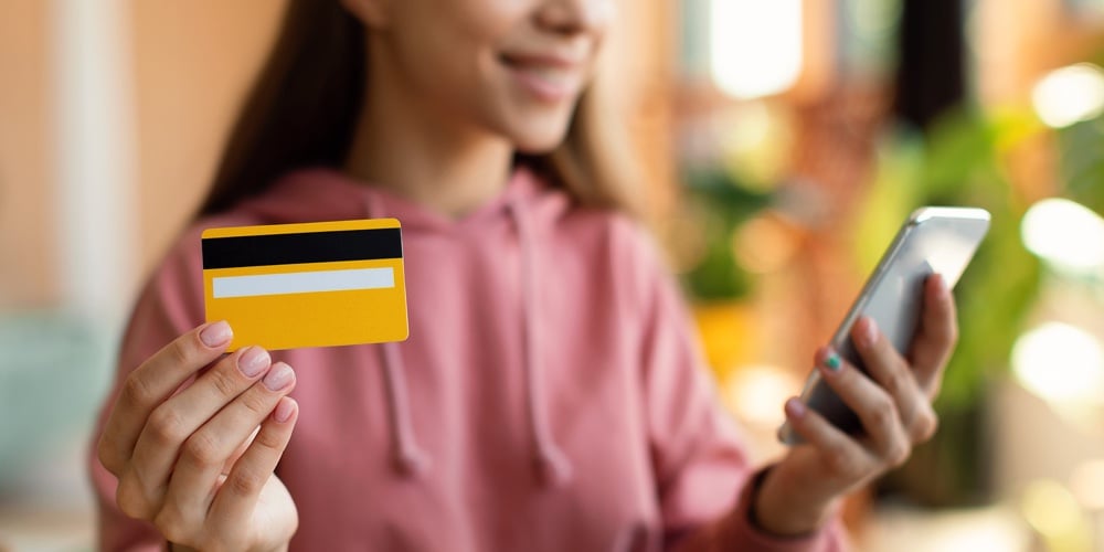 Smart Teen Girl Student Pay Money With Credit Card And Smartphone