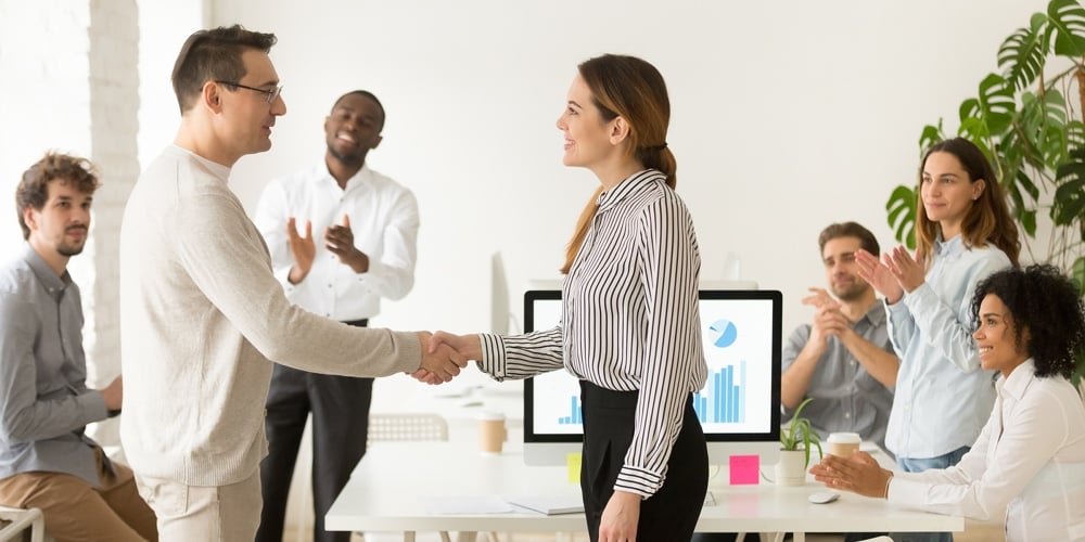 bigstock-Smiling-Female-Boss-Promoting-241217956