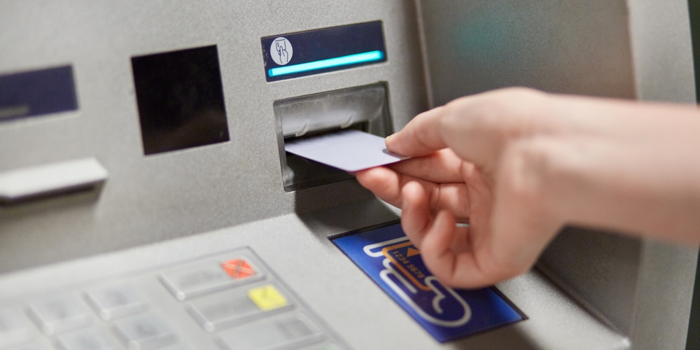 Someone Takes Off Money From Outdoor Bank Terminal