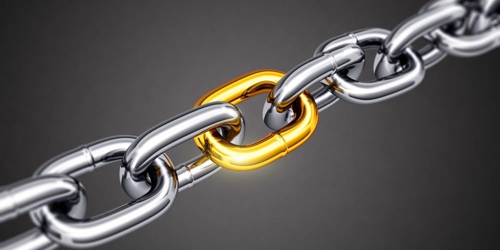 bigstock-Steel-chain-with-a-gold-link-84179888-e1450125233764