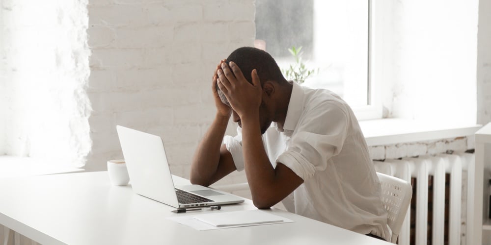bigstock-Stressed-Black-Businessman-In-225766600