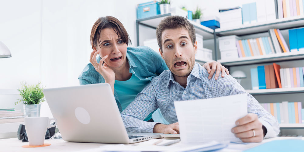 bigstock-Stressed-Couple-Checking-Bills-119631692