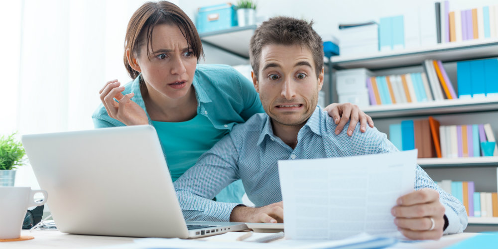 bigstock-Stressed-Couple-Checking-Bills-145196378