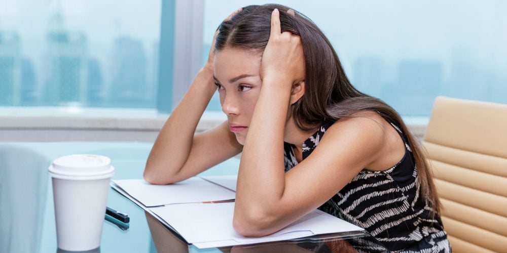 bigstock-Stressed-business-woman-at-off-150075878-e1526386073486