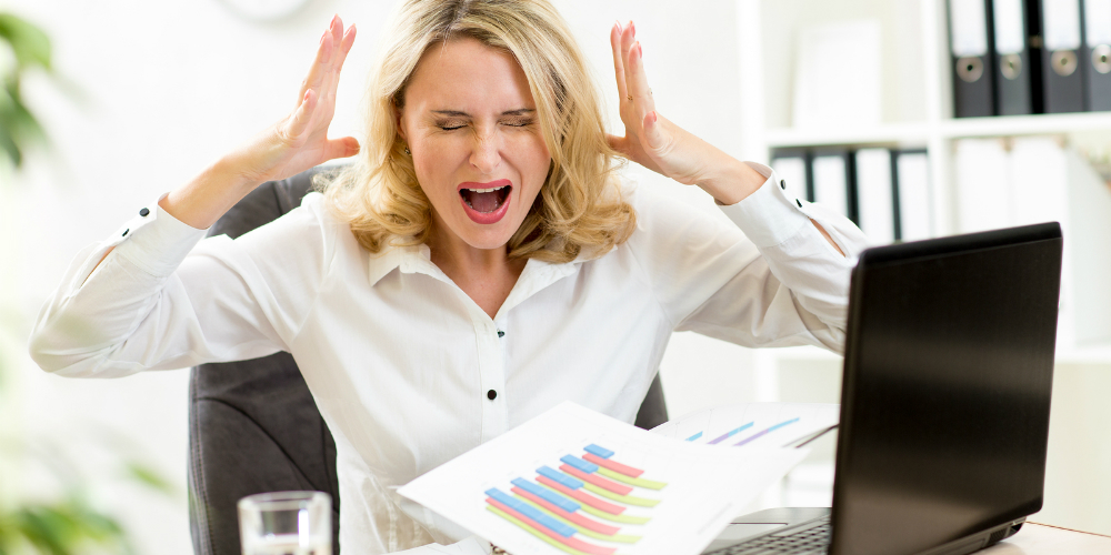 bigstock-Stressed-businesswoman-at-lapt-97005800