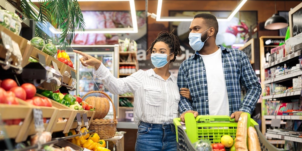 Supermarket Buyers. African American Couple Doing Grocery Shopping Together