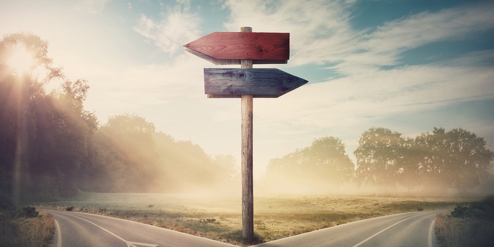 Surreal Landscape With A Split Road And Signpost Arrows Showing Two Different Courses