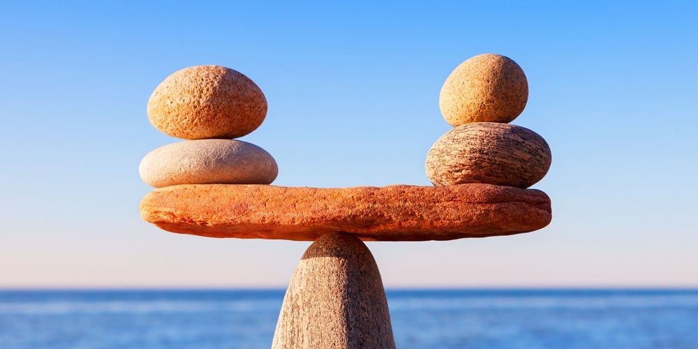 Symbolic Scale Of The Stones On Sea Background Closeup. Concept Of Harmony And Balance. Work-life