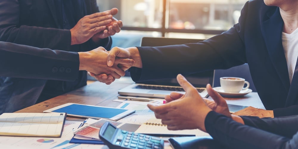bigstock-Team-Business-Partners-Shaking-412510384