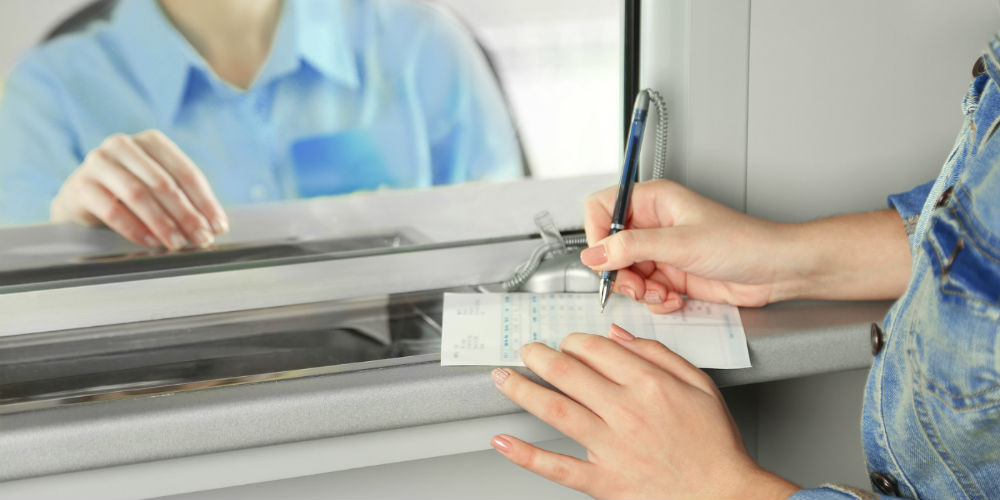 bigstock-Teller-window-with-working-cas-83204927