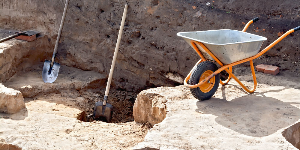 bigstock-Tools-at-the-site-Archaeologic-84964577