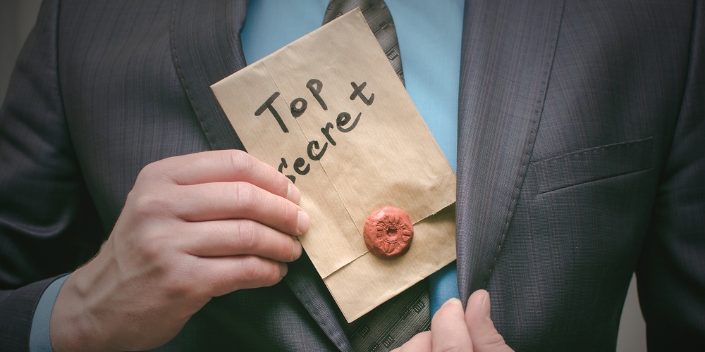 Top Secret Documents Presentation Concept. Top Secret Message In Detective Spy Agent Hands. Confiden