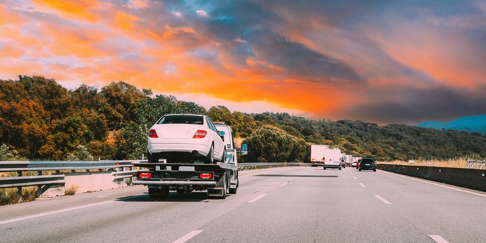 Tow Truck Transporting Car Or Help On Road Transports Wrecker Broken Car. Car Service Transportation