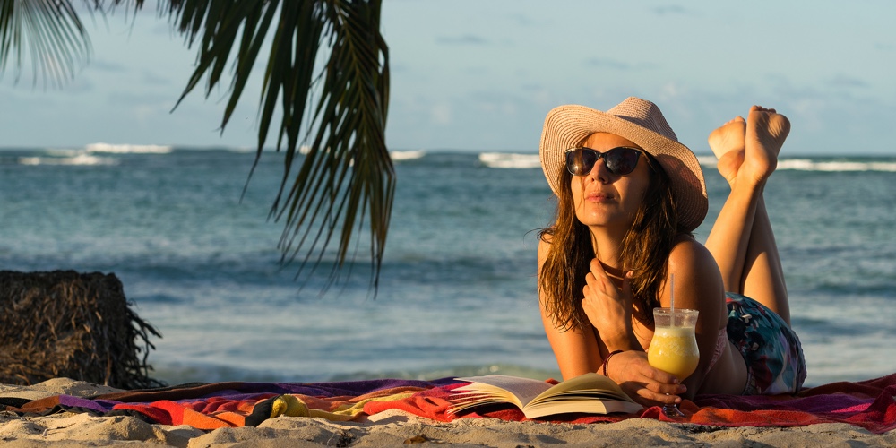 Traveler Girl Relaxing On Tropical Beach. Young Girl Traveler Relaxing In Vacation. Traveler Relaxin