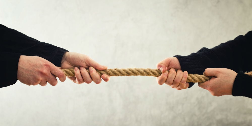 bigstock-Tug-Of-War-Hands-Pulling-Rope-61883048