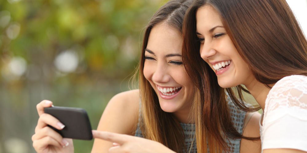bigstock-Two-Funny-Women-Friends-Laughi-81360125