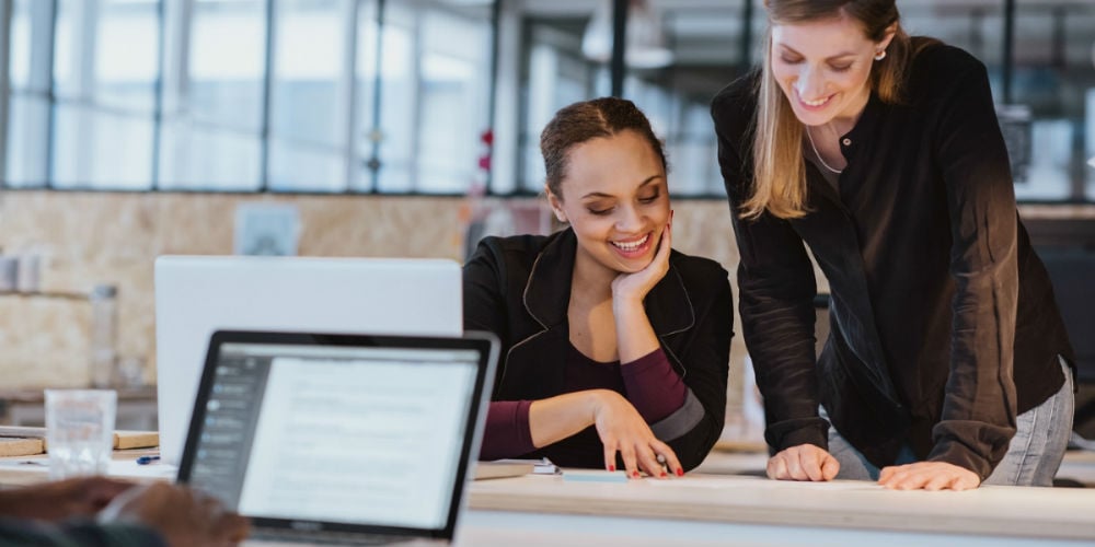 bigstock-Two-Young-Woman-Working-On-A-N-82256669