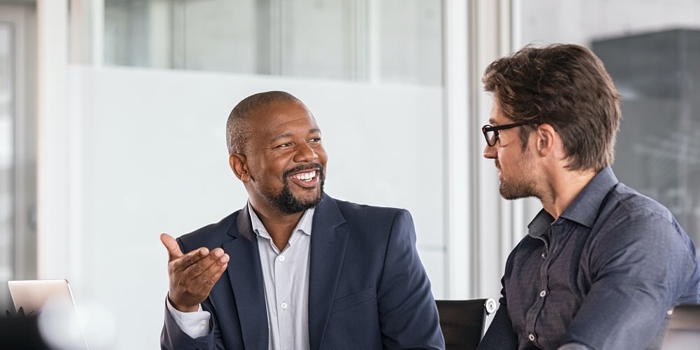 bigstock-Two-happy-business-colleagues-340724572