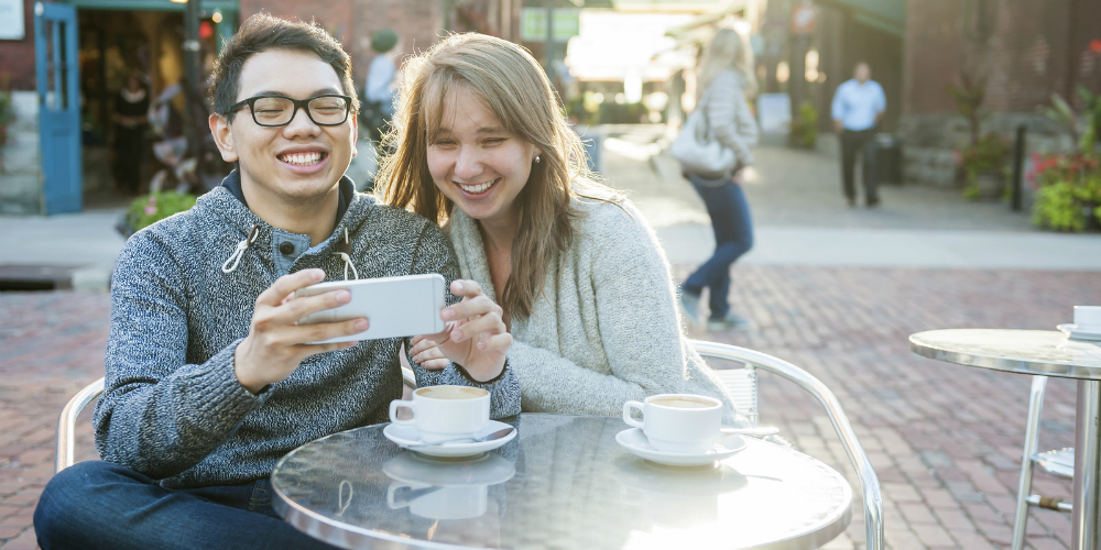 bigstock-Two-laughing-young-people-look-120458582|bigstock-Two-laughing-young-people-look-120458582