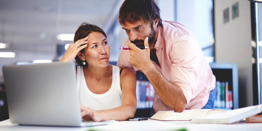 bigstock-Two-office-workers-talking-in-94936340