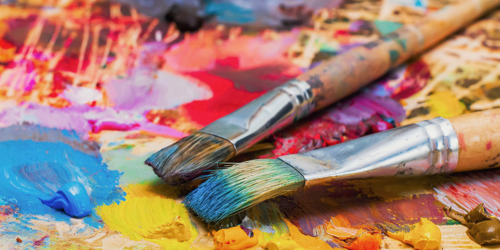 bigstock-used-brushes-on-an-artist-s-pa-110849459
