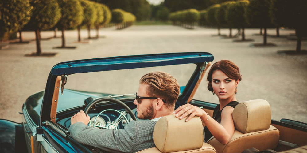 bigstock-Wealthy-couple-in-a-classic-co-99547040