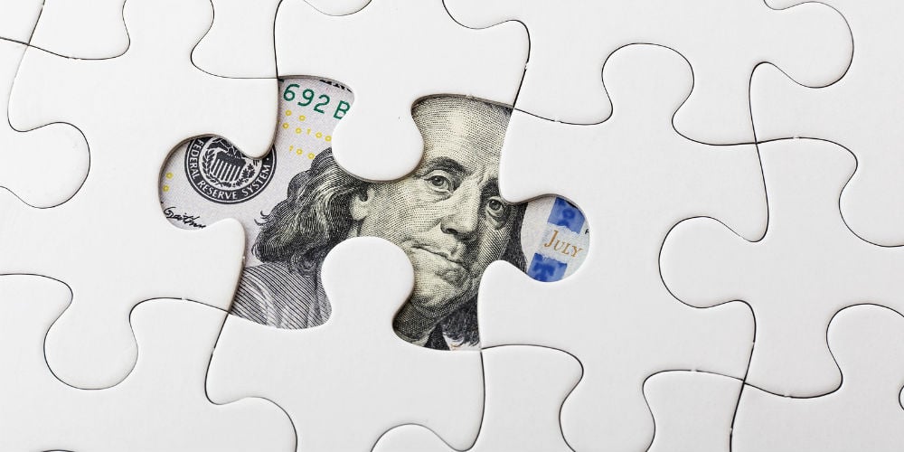 bigstock-White-puzzle-and-US-banknote-60075920