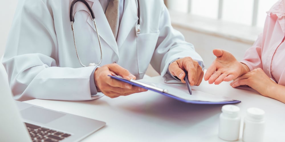 bigstock-Woman-At-Doctor-125388143