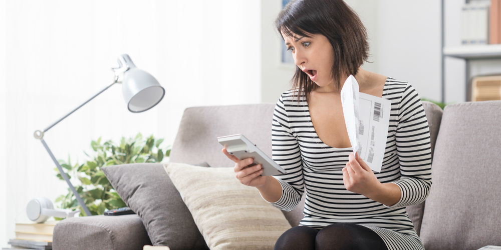 bigstock-Woman-Checking-Expensive-Bills-151685699