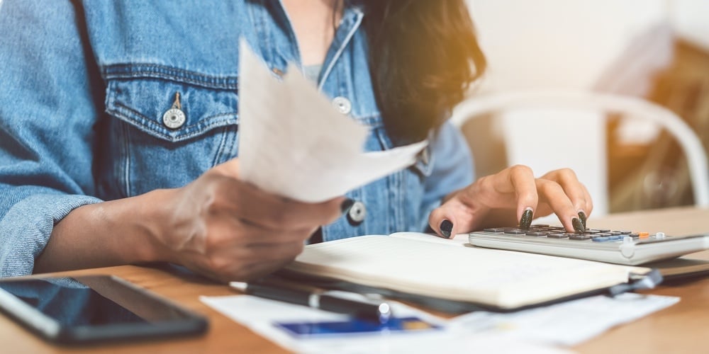bigstock-Woman-Doing-Accounting-Home-Fi-371124223