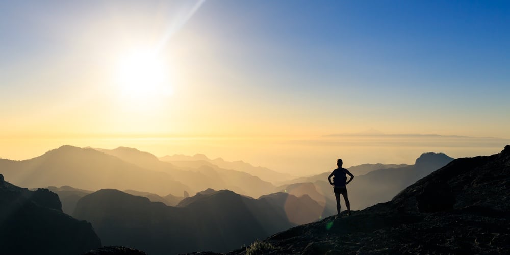 bigstock-Woman-Hiking-Silhouette-In-Mou-265969543