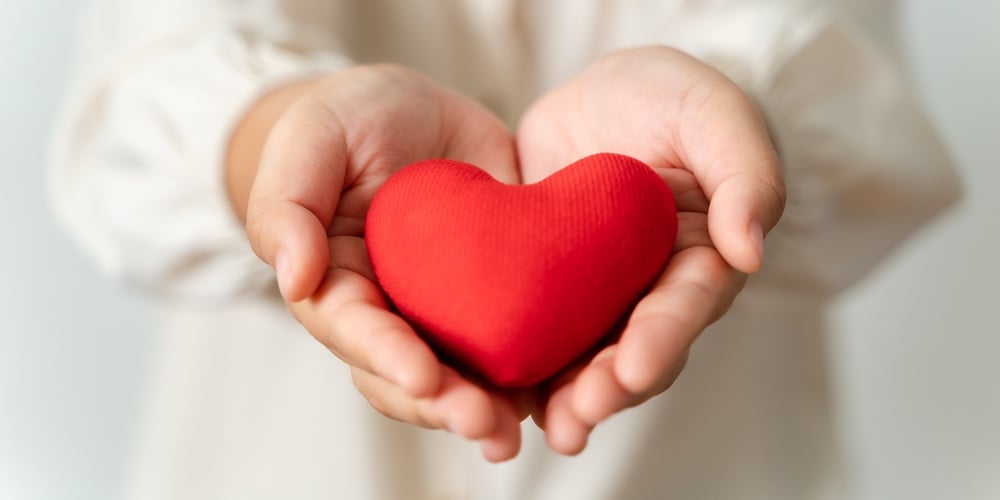 bigstock-Woman-Holding-Red-Heart-Love-467613735